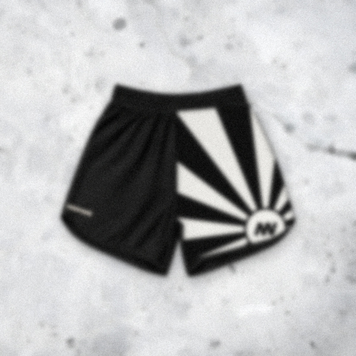 A blurred first look at the Genesis fight shorts on concrete